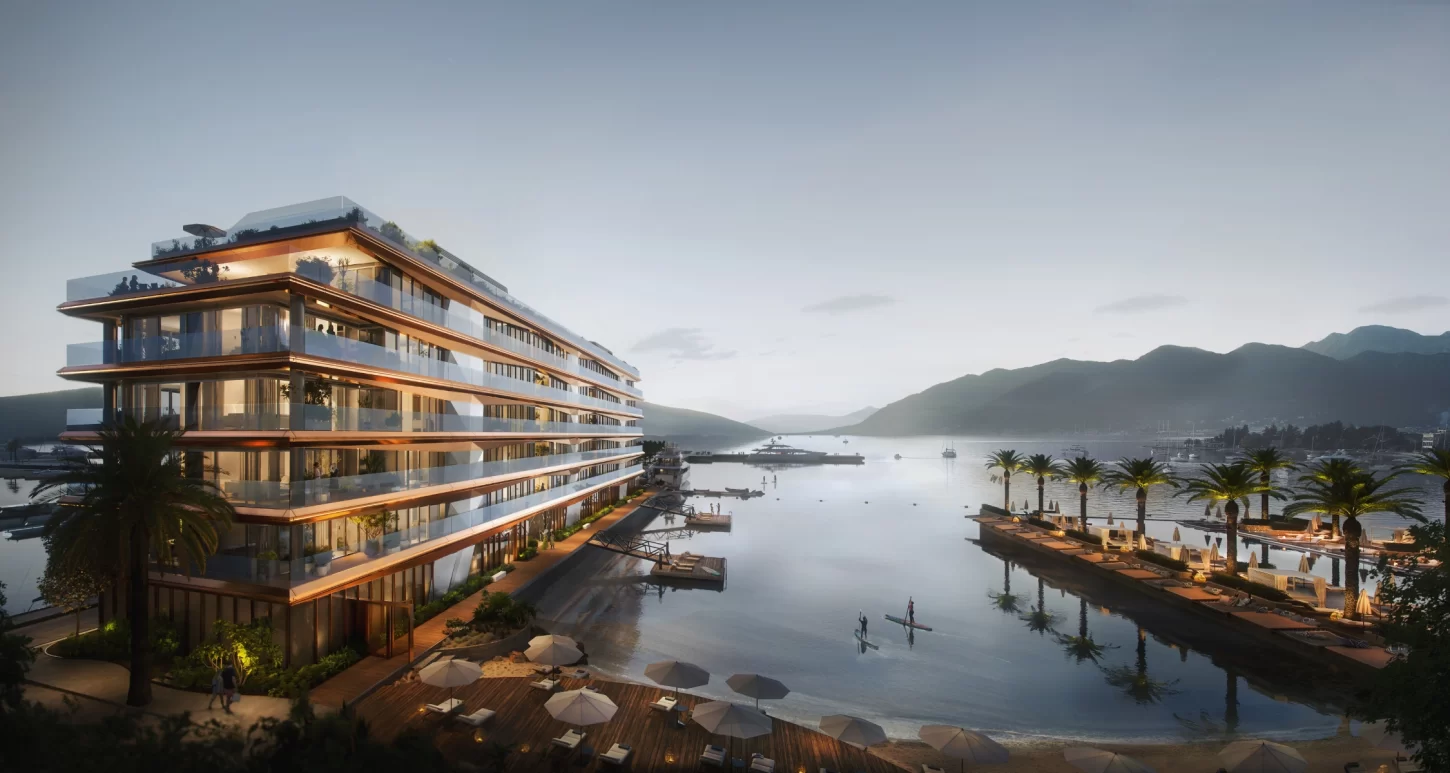 Luxurious Aeris Residences at Synchro Yards in Porto Montenegro at night, featuring sleek modern architecture and stunning waterfront views.