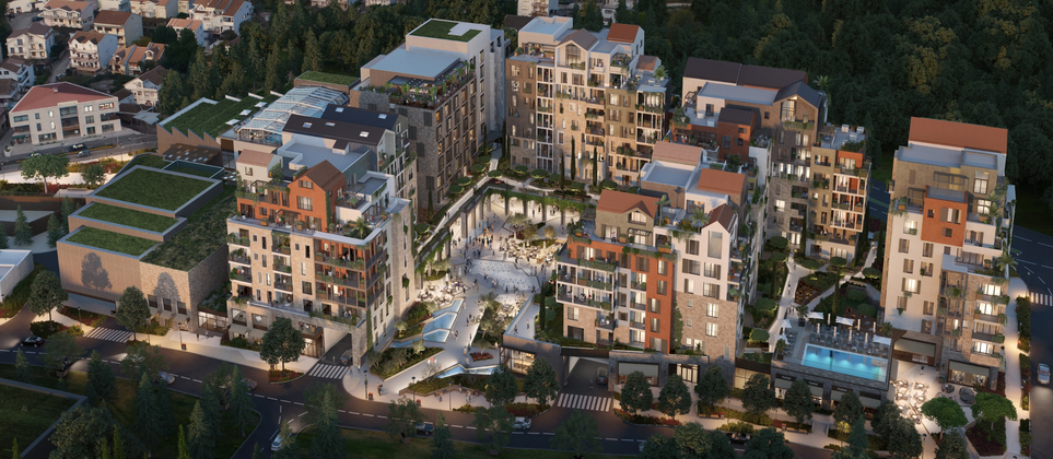 Aerial view of the Boka Place neighborhood, part of Residences Porto Montenegro, showcasing modern buildings, communal areas, and green spaces at dusk.