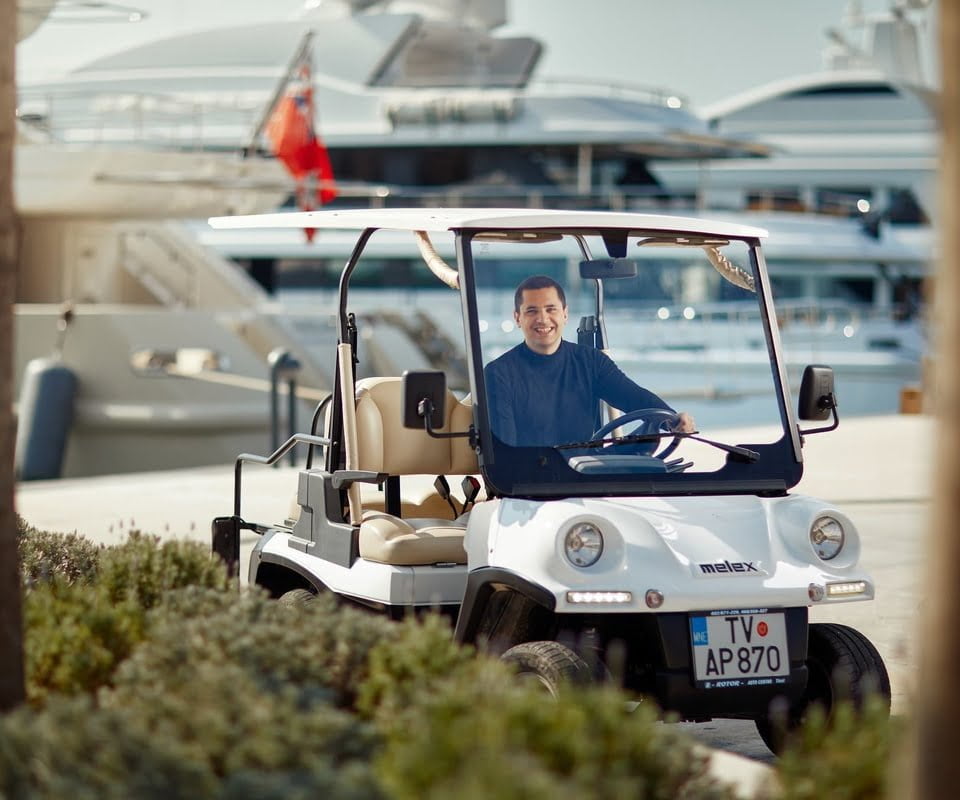 Man driving golf buggy