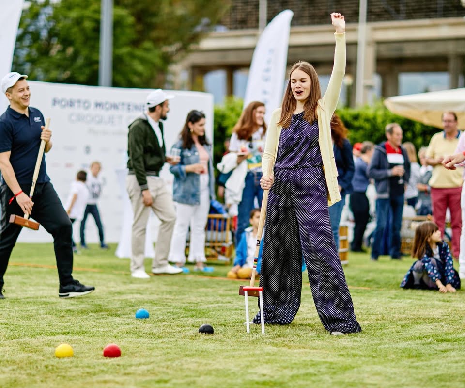 People playing croquet