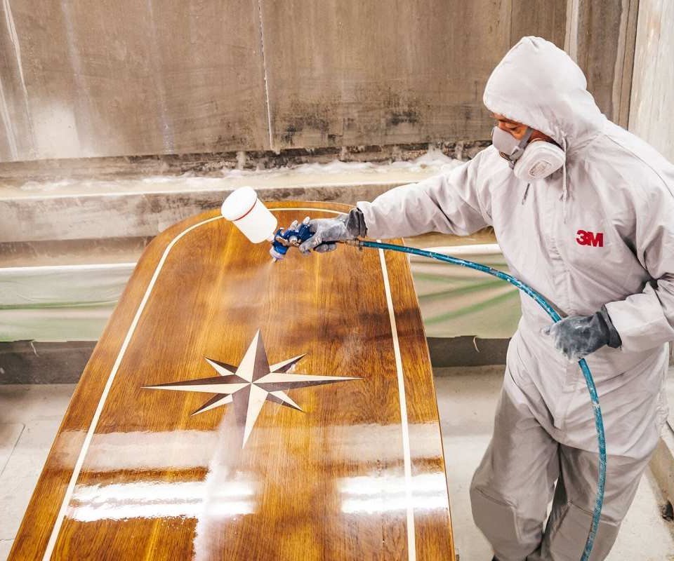 Man painting yacht