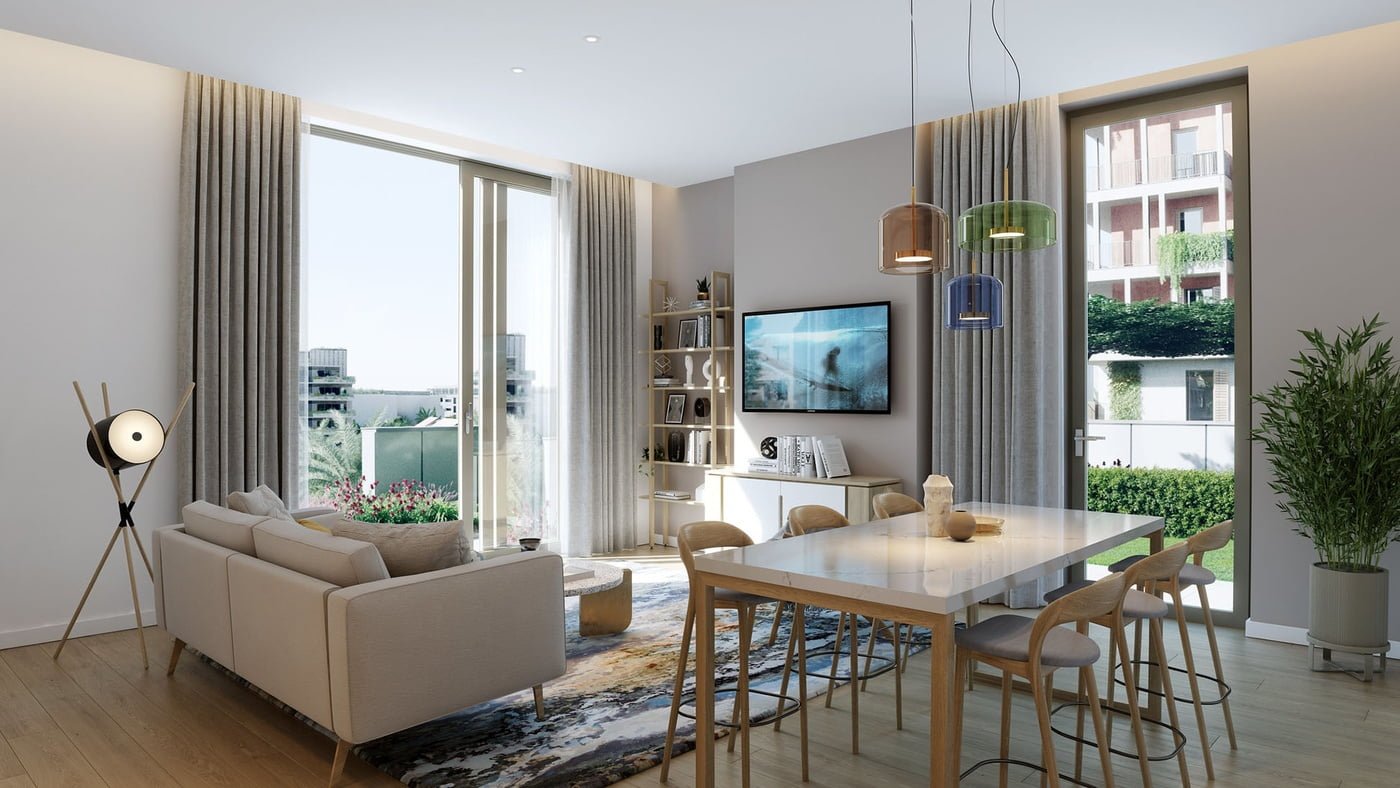 Modern apartment interior with a cosy living room that opens to a balcony with greenery.
