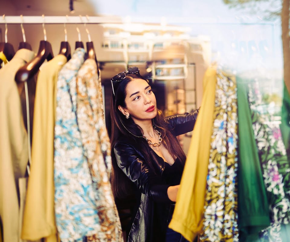 Lady looking at clothing whilst shopping
