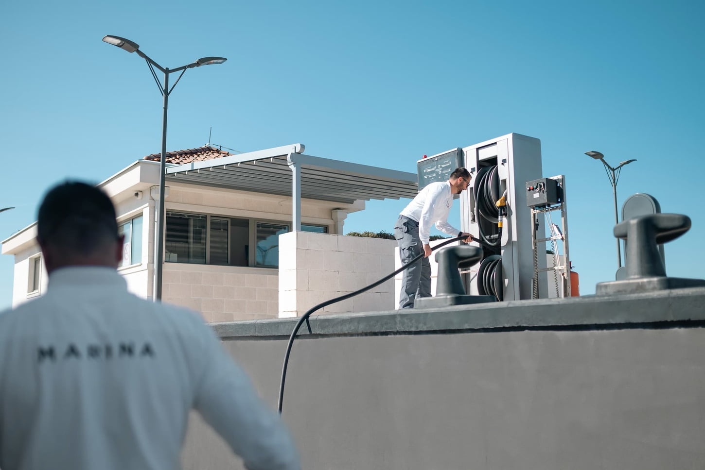 Marina team re-fuelling yacht