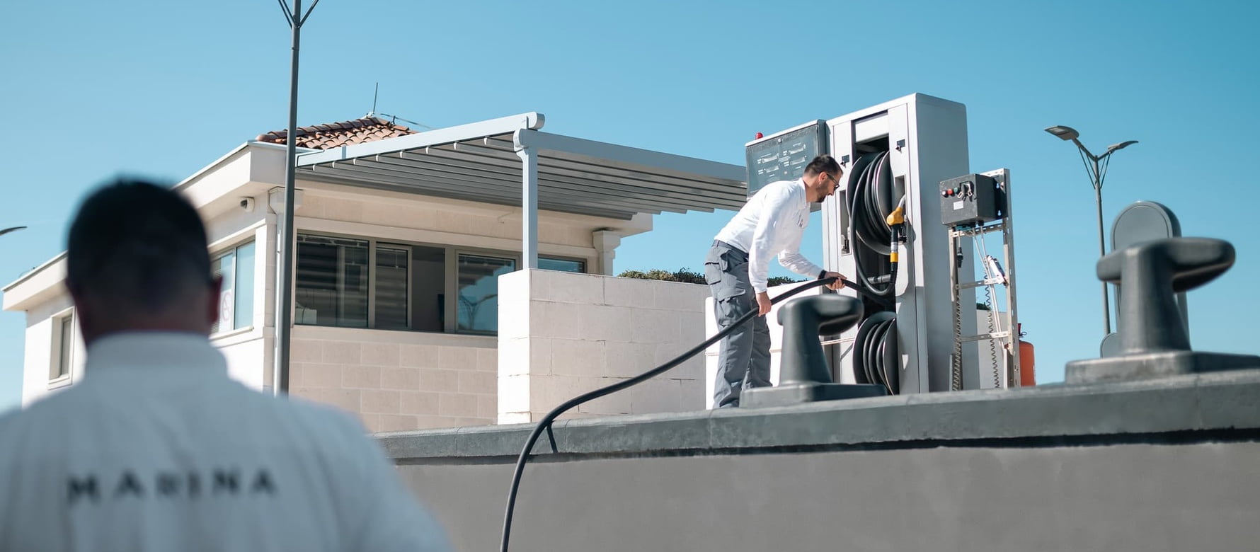 Marina team re-fuelling yacht