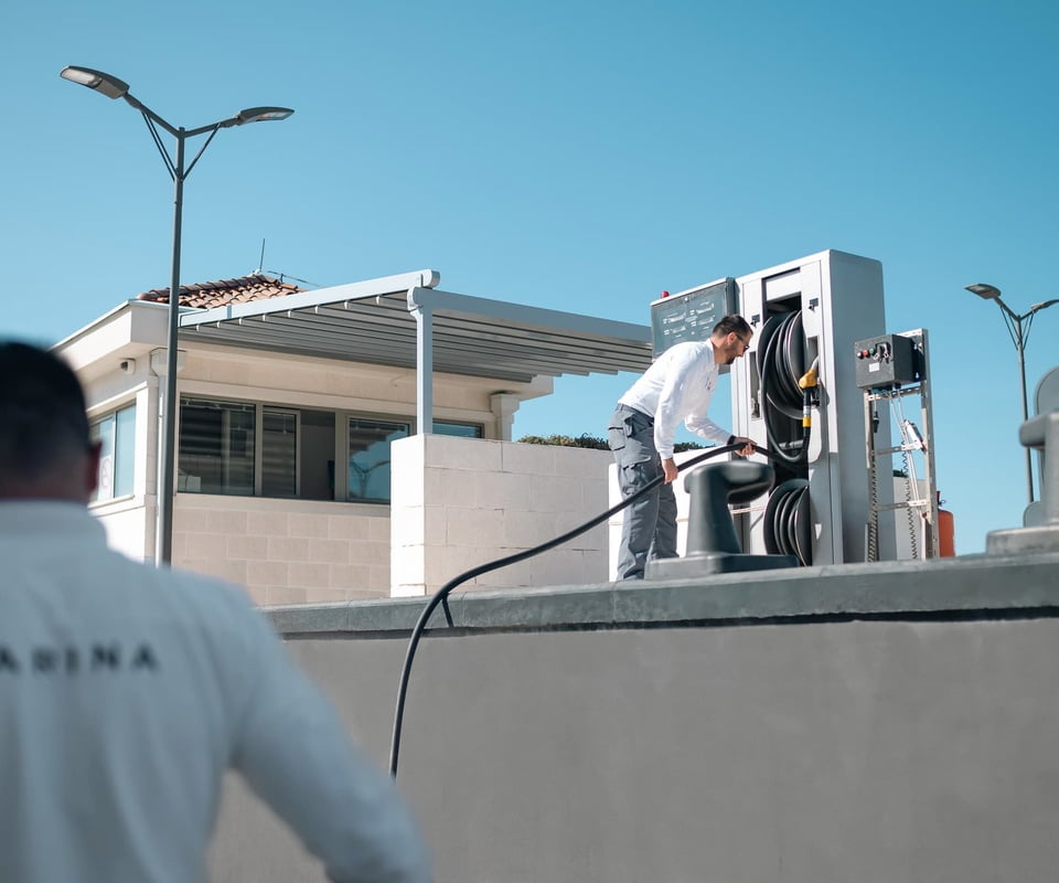 Marina team re-fuelling yacht