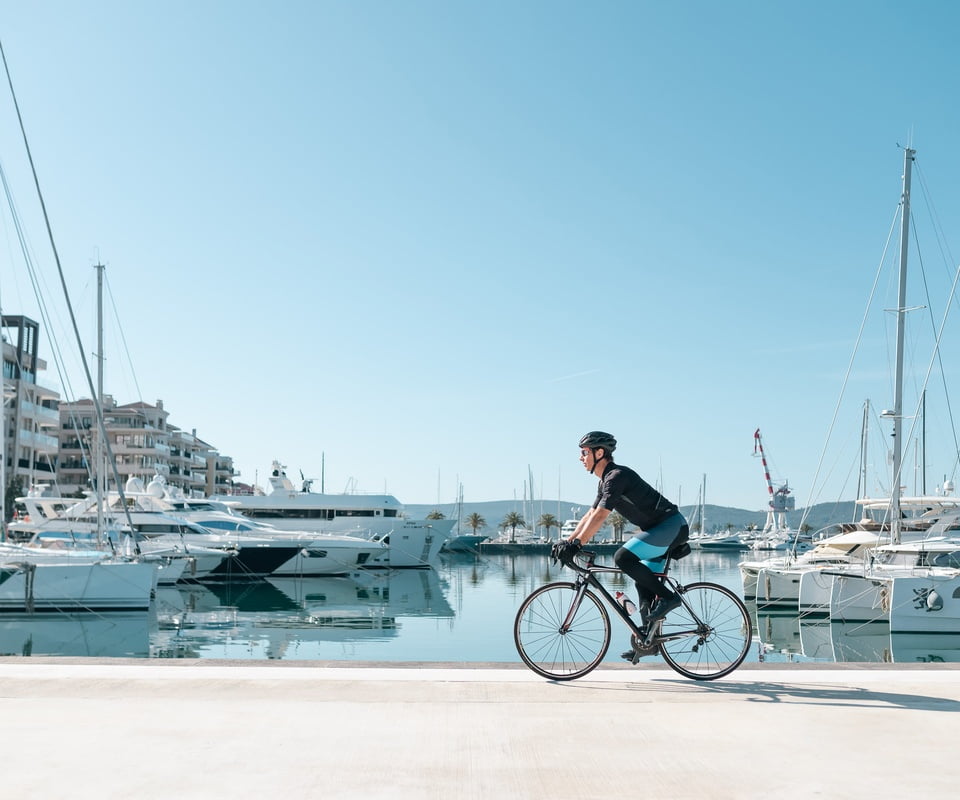 Man cycling Porto Montenegro