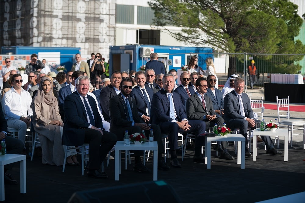 People sitting and watching ceremony