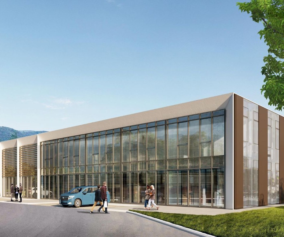 Entrance view of the Adriatic Business Club, showcasing the building in day light with its modern architectural design with a sleek glass facade, set amidst vibrant greenery, creating a serene and professional environment.