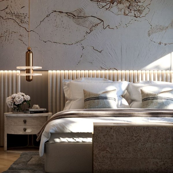Elegant bedroom detail in AERIS, Porto Montenegro, featuring a textured wall design, a stylish pendant light, and a contemporary bed with neutral linens, creating a peaceful and sophisticated atmosphere.