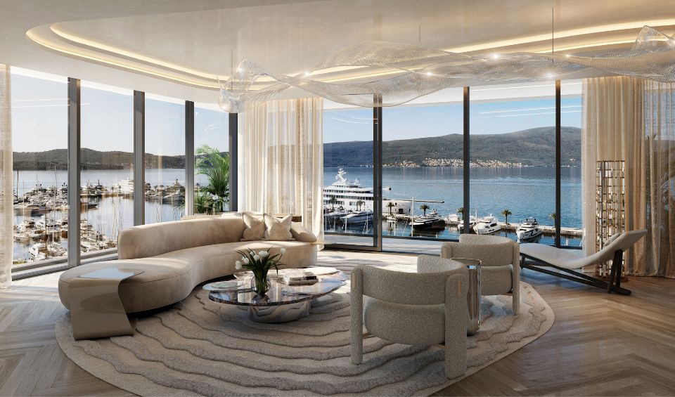 Luxurious living room in AERIS, Porto Montenegro, with contemporary furnishings, unique overhead lighting, and a sweeping view of the marina through floor-to-ceiling windows, creating a serene and stylish ambiance