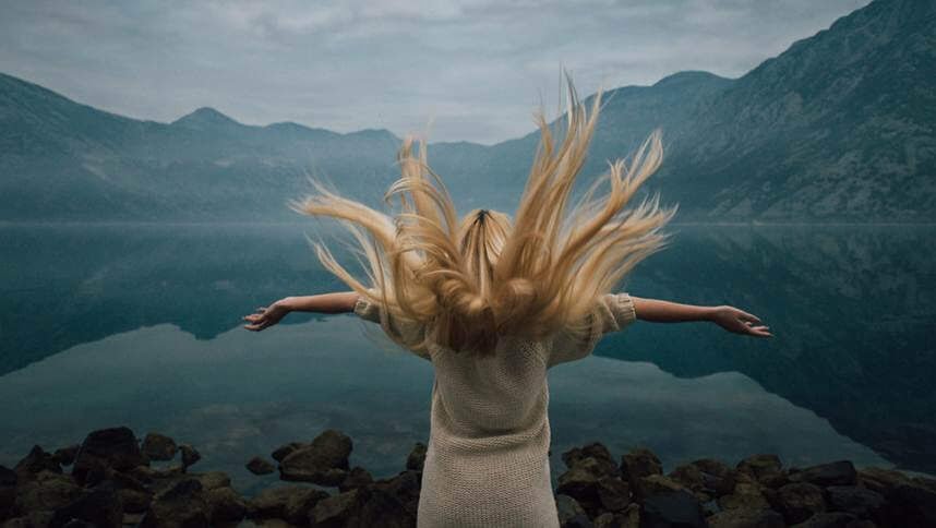 Blonde girl on the shore