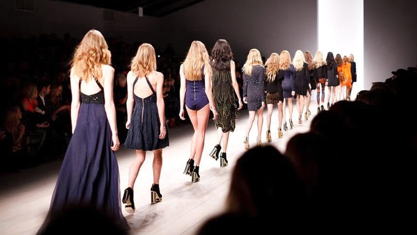 women walking a catwalk fashion show