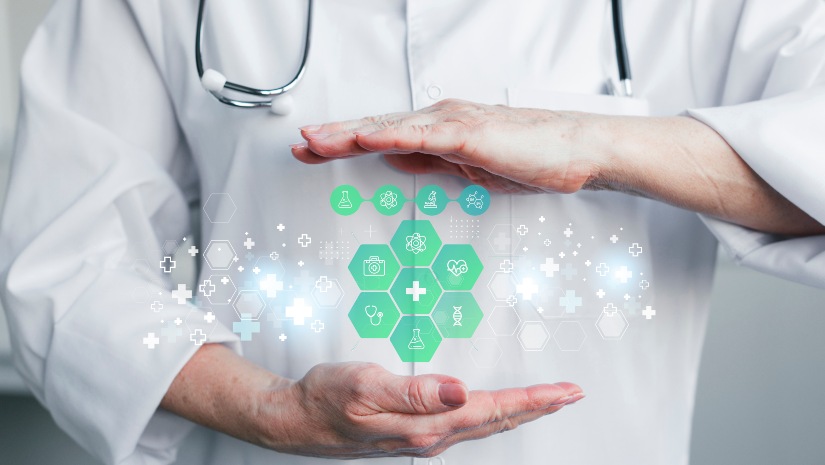 A doctor stands confidently, holding a green and white medical icon, symbolizing health and care in a professional setting.