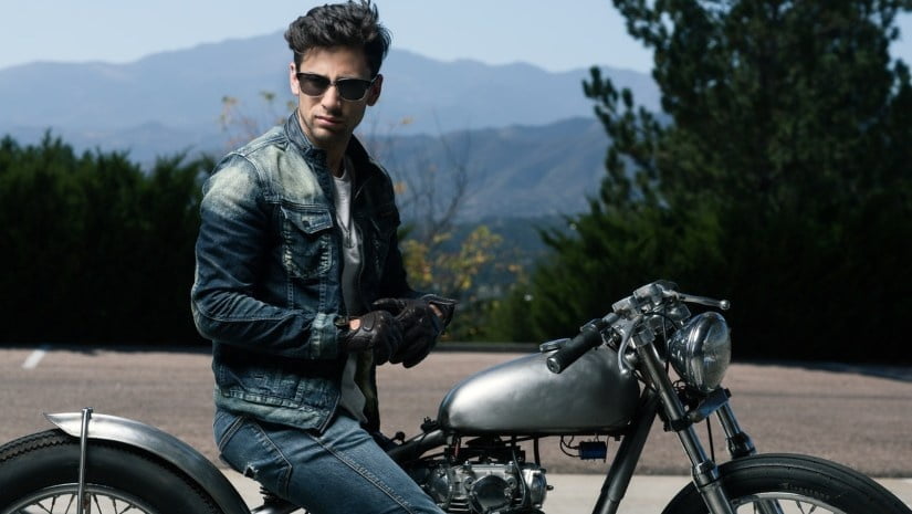 man in texas clothes on the motorcycle