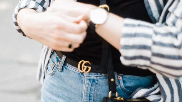 Gucci black belt on a woman