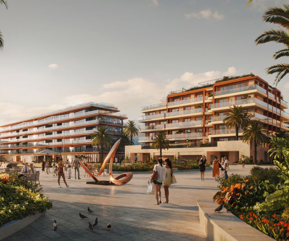 Sunny courtyard scene at the IVO Residences in Porto Montenegro, featuring a modern apartment complex with terraced balconies surrounded by tall palm trees and vibrant greenery.
