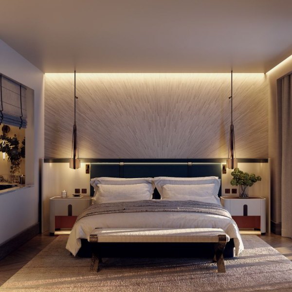 Elegant bedroom adorned with a plush bed and a sleek wall-mounted lamp, exuding a serene ambiance.