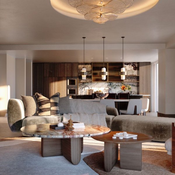 Luxurious living room interior in IVO Residences, Porto Montenegro, highlighted by an artistic ceiling design, stylish pendant lighting, and sophisticated furnishings set against a backdrop of a modern kitchen.