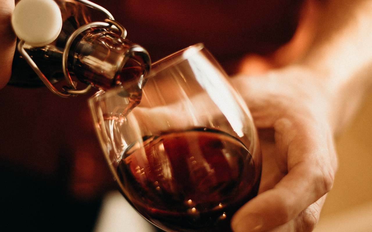 person-pouring-wine
