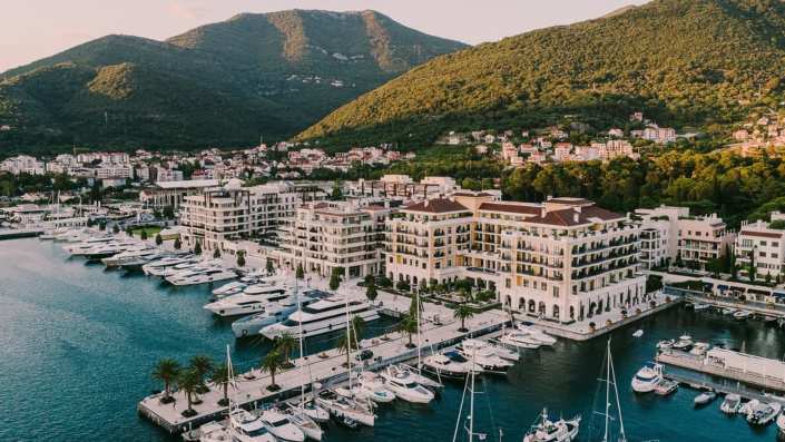 Panoramic view of the luxurious Regent Hotel in Montenegro, showcasing its stunning architecture and scenic surroundings along the Adriatic coast.