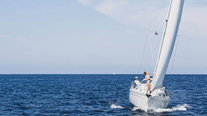 Sailing on the open sea girl woman on the boat