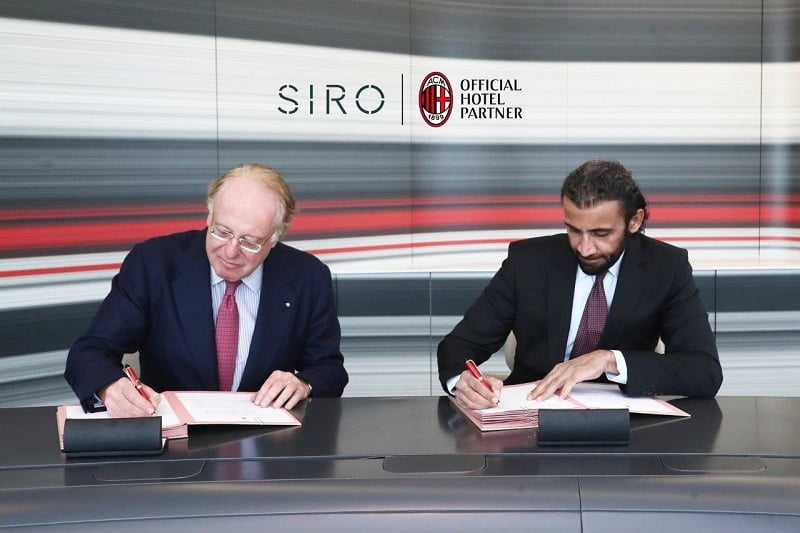 two guys signing the contract