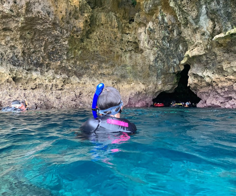 Woman swimming in Blue Cave