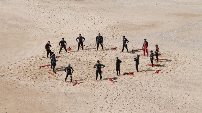 swimmers gathered at beach