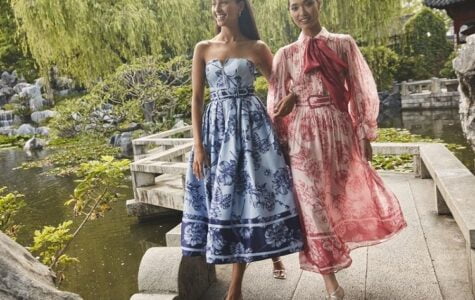 Two girls walking near the river