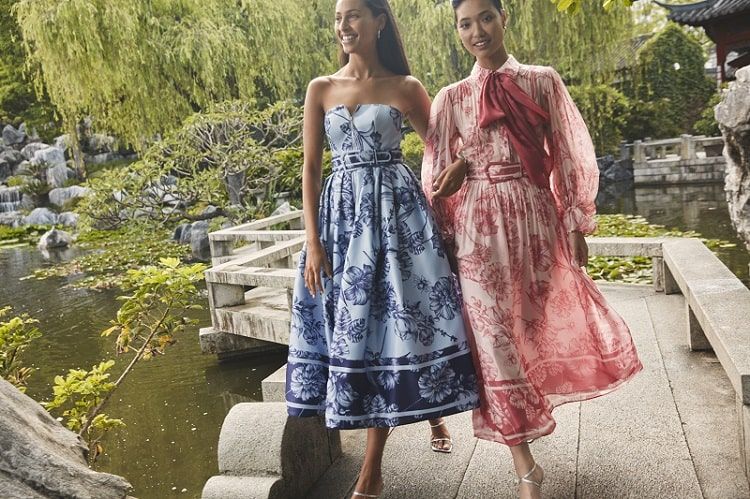 Two girls walking near the river