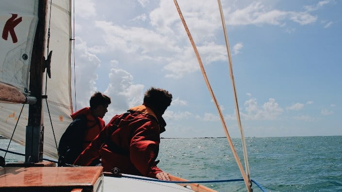 Two men sailing on the sea