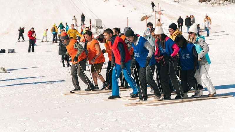 people on the snow playing games