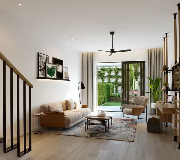Modern living room at Boka Place residences, featuring sleek, minimalist furniture, neutral tones, and natural light flowing through large glass doors that open to a lush garden.