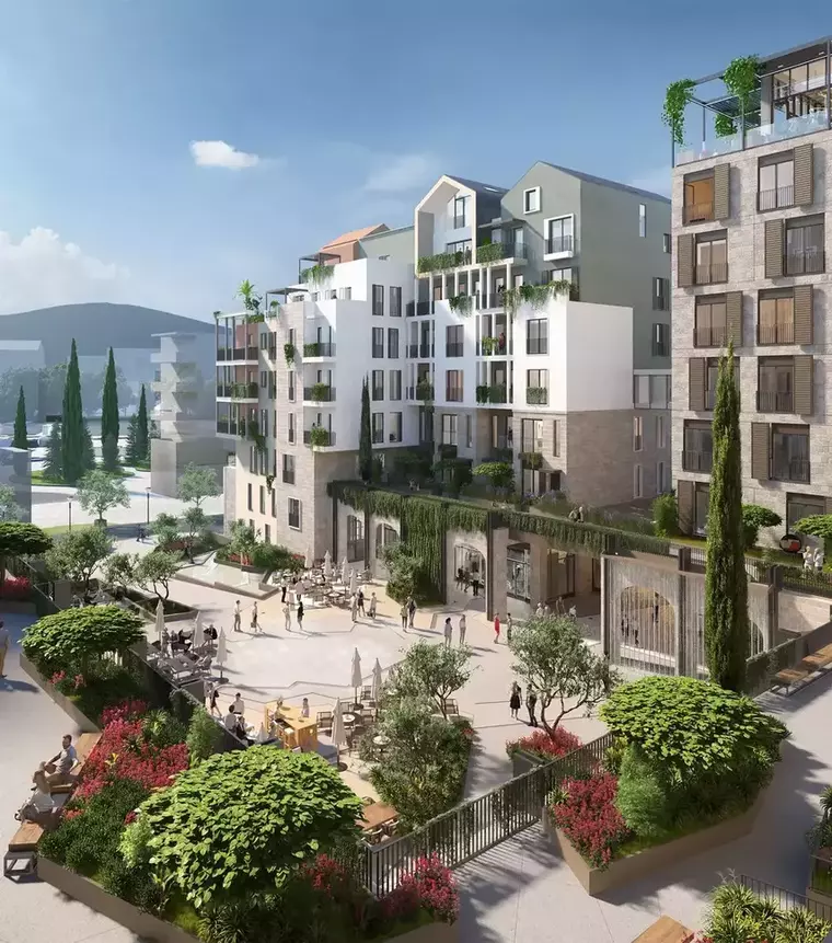 Charming urban square with Mediterranean-inspired architecture, featuring residential buildings, lush greenery, and people enjoying outdoor cafés and social spaces.
