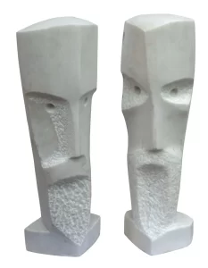 Two stone sculptures by Zoran Obrenovic, featuring stylized human faces.